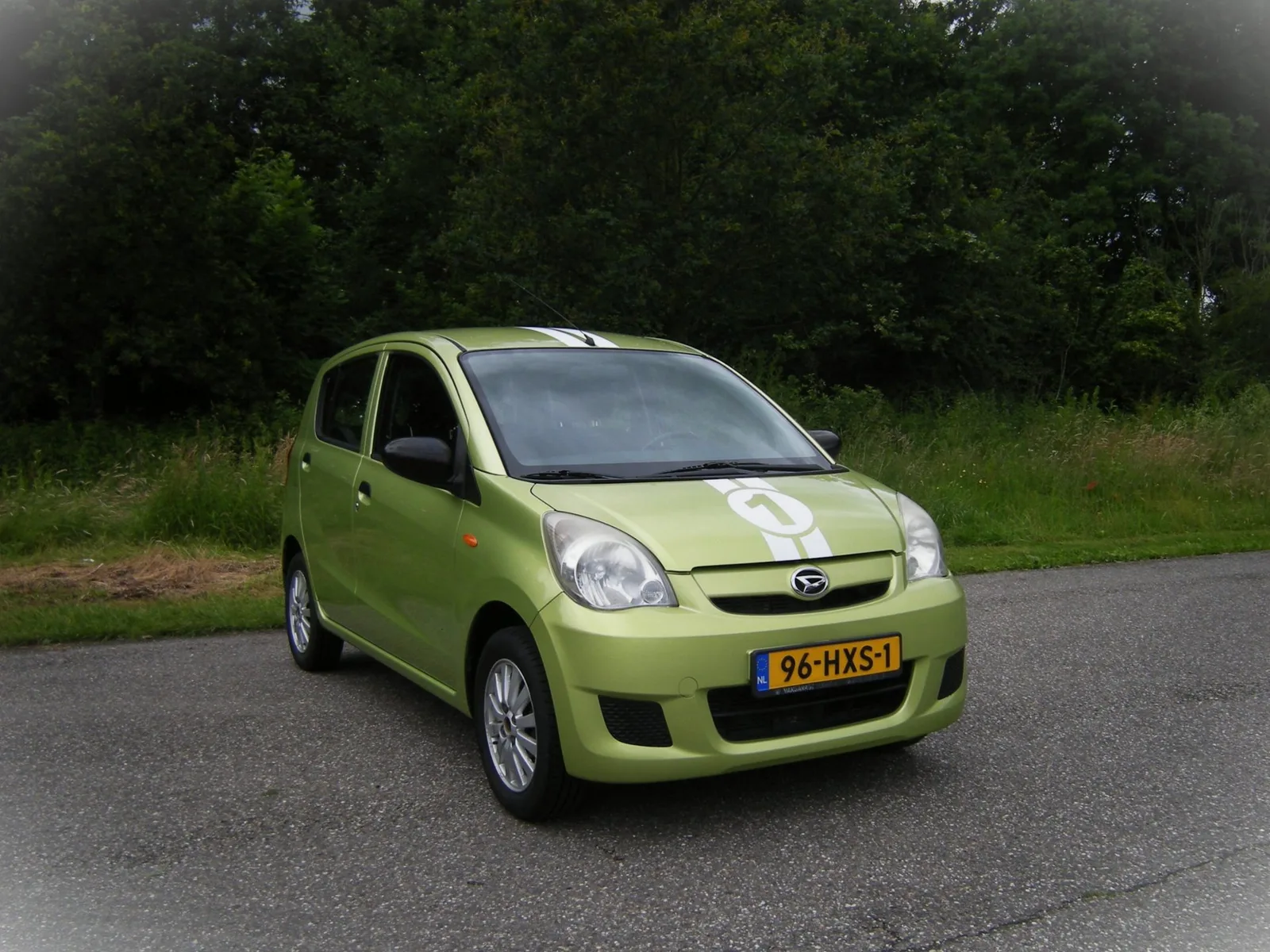Daihatsu Cuore (2009) — foto 1