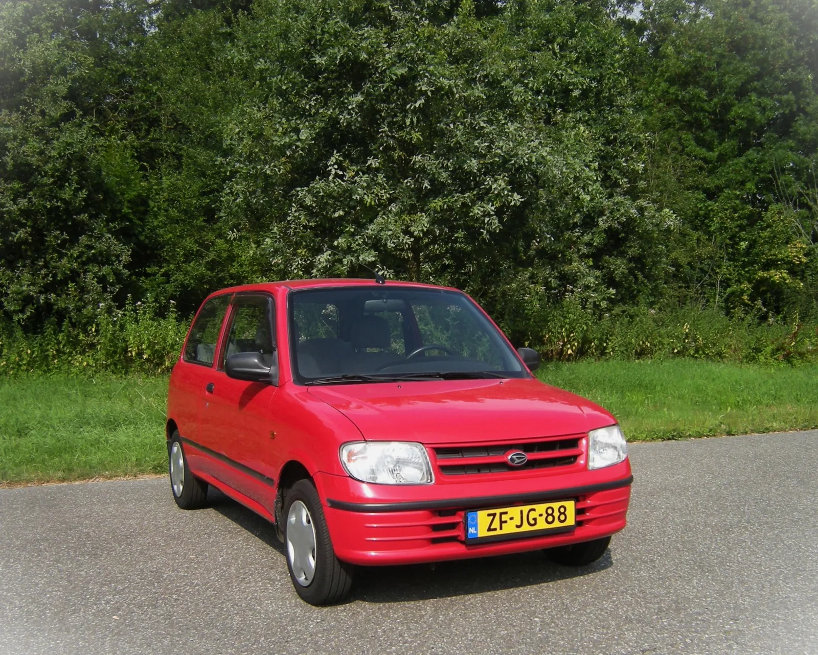 Daihatsu Cuore (1999) — foto 1